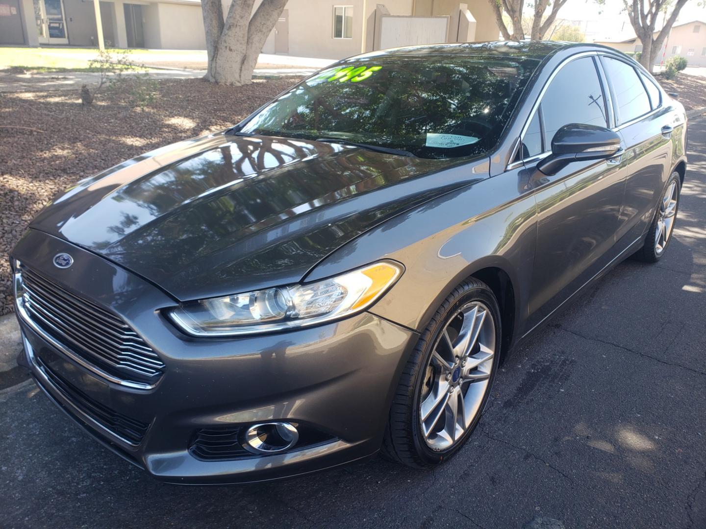 2016 /gray and black Ford Fusion titanium (3FA6P0K99GR) with an 2.0L L4 DOHC 16V engine, 4-Speed Automatic transmission, located at 323 E Dunlap Ave., Phoenix, AZ, 85020, (602) 331-9000, 33.567677, -112.069000 - 2016 Ford Fusion Titanium,......EXCELLENT condition, A Real Must See!!....ONLY 118K MILES,...... No accidents, Power everything, Touch screen Stereo/cd player, Phone sync, Bluetooth, Satellite compatible, Buckup camera, Navigation, Ice cold ac, Clean gray and Black interior with black leather seats - Photo#0